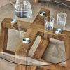 Modern practical circular coffee and tea tables. Made of transparent tempered glass tabletop and wood colored MDF material. Suitable for living rooms